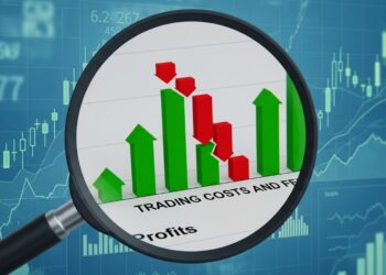 Magnifying glass showing hidden trading fees